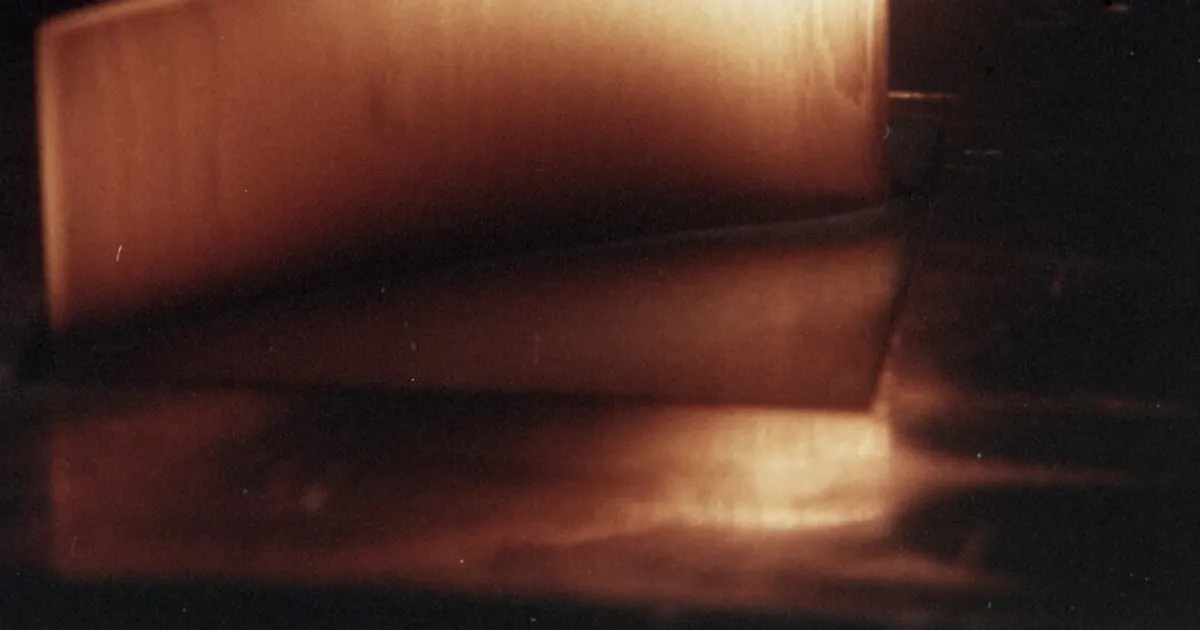 SiC/Si3N4 ceramic airfoil glowing hot during a thermal shock test, NASA photograph